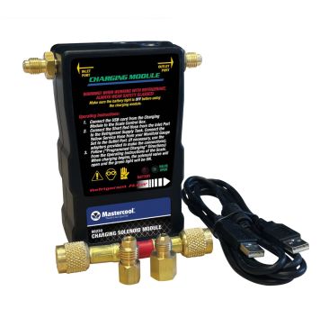 A Mastercool 98230 Charging Solenoid Module is shown with its accessories. The black module has labelled inlet and outlet ports, a USB cord, and two brass adapters with a short red hose. Warning labels and operating instructions are printed on the module,
