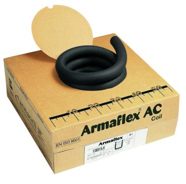 A cardboard box with the lid partially open contains a coiled black Armaflex AC Coil insulation tube. The box is labelled "Armaflex AC Coil" with additional details such as "EN ISO 9001" certification, product code "13X015/E," and dimensions "32." A ruler