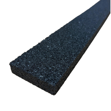 A close-up image of a black rubber anti-vibration strip with a textured surface, measuring 1m x 75mm x 15mm. The strip is shown against a black background, highlighting its thickness and porous structure, which is ideal for reducing noise and vibrations i