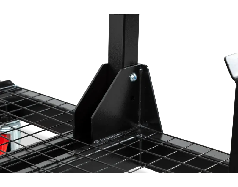 Close-up of Armorgard PipeRack base, showing a sturdy black steel mesh platform and vertical support connection, designed for secure pipe and conduit storage on construction sites.