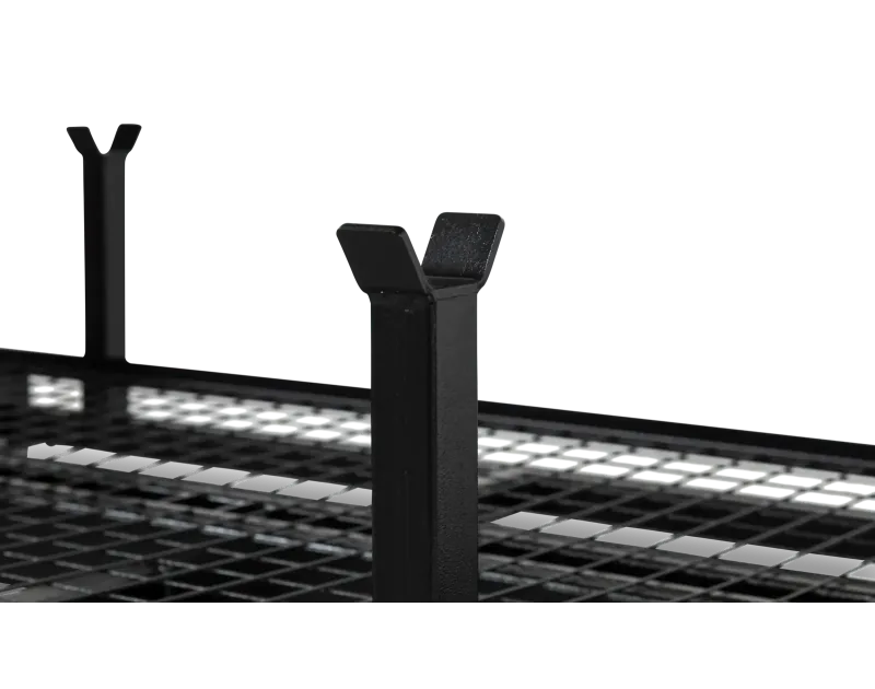 Close-up of Armorgard PipeRack vertical support with a Y-shaped top, attached to a black steel mesh base, designed for secure pipe and conduit storage on construction sites.
