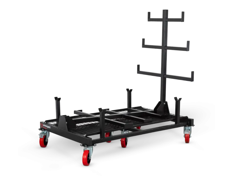 Armorgard PipeRack with one side raised, showcasing a black steel frame, red castor wheels, and horizontal arms for secure pipe and conduit storage on construction sites.