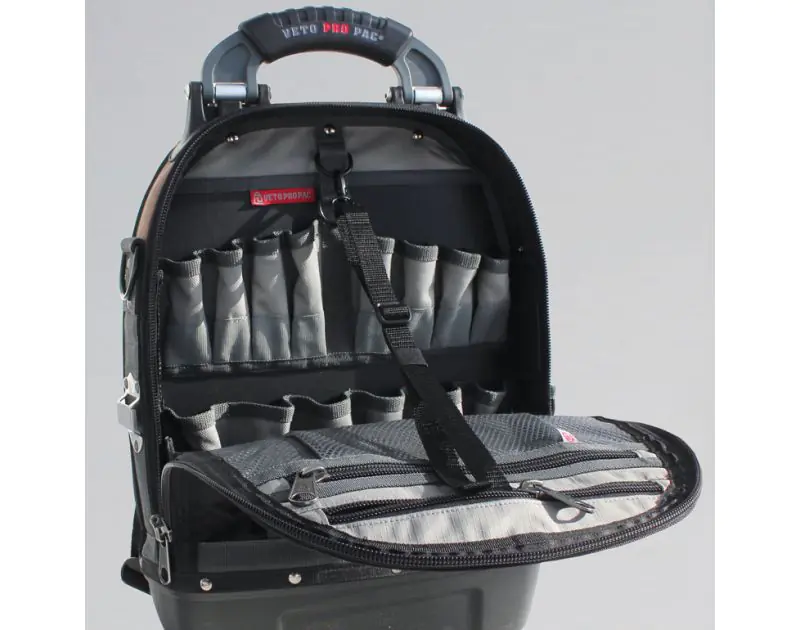 Inside view of an open Veto Pro Pac Tech Pac tool backpack, revealing its organised interior with multiple pockets and slots for tools. The bag features 46 interior and exterior pockets, including dedicated spaces for small tools and accessories, with a s