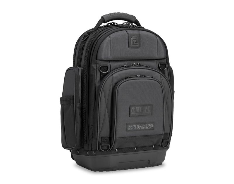 A black Veto Pro Pac EDC PAC LCB Carbon everyday carry backpack with a rugged design, featuring a sturdy handle, multiple pockets, and a waterproof base with 5" wheels. Includes a trolley system and carbon finish, ideal for HVAC/R professionals. A black Veto Pro Pac EDC PAC LCB Carbon everyday carry backpack with a rugged design, featuring a sturdy handle, multiple pockets, and a waterproof base with 5" wheels. Includes a trolley system and carbon finish, ideal for HVAC/R professionals.