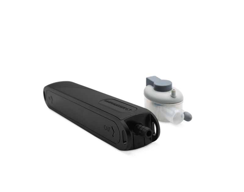 The Sauermann Si-20 Mini Condensate Pump has a detection unit, black pump body, and transparent reservoir against a black background. The Sauermann Si-20 Mini Condensate Pump has a detection unit, black pump body, and transparent reservoir against a black background.