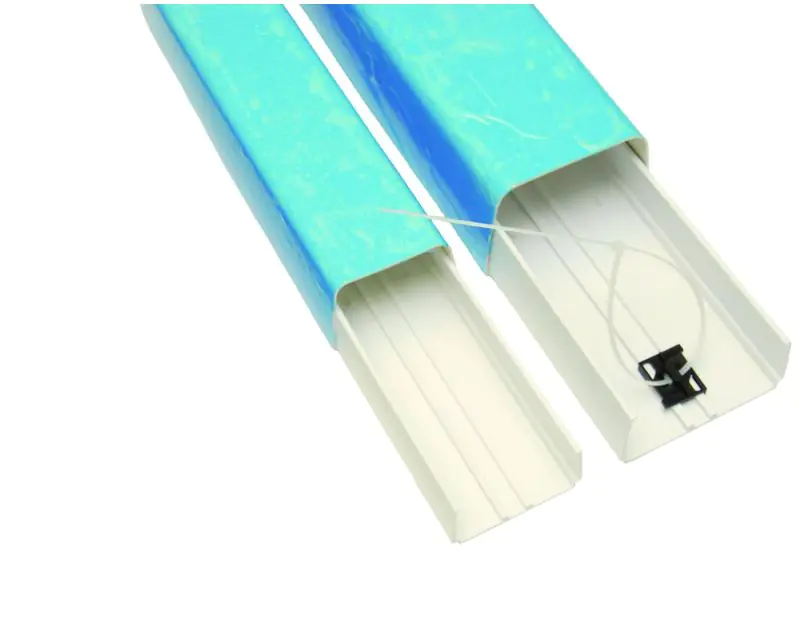 Two blue Sauermann DUE110W Duct Line Set Protection pieces, one with a cover and one without, showing the internal structure with a cable tie securing a white cable, designed for concealing and protecting air conditioning cables and pipes, displayed again