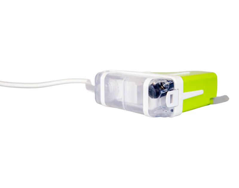 Silent+ Mini Lime Condensate Pump by Aspen Pumps, featuring a green and white elbow design with attached tubing, displayed on a black background, viewed from the right side with a focus on the reservoir.