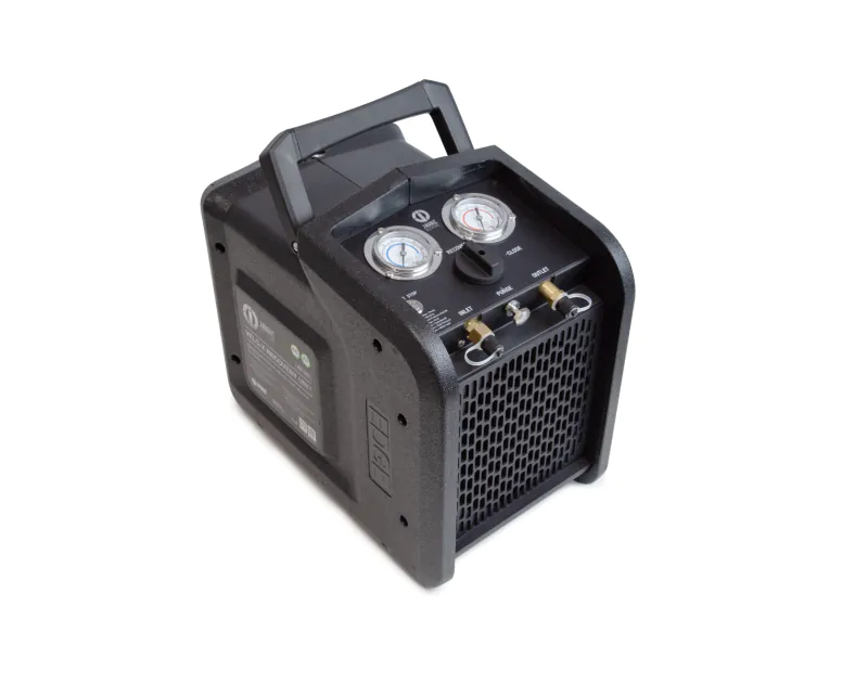 Black JAVAC Velo-X Twin Cylinder Recovery Unit Pro with dual gauges, control knob, brass fittings, and a sturdy handle, designed for HVAC refrigerant recovery. Black JAVAC Velo-X Twin Cylinder Recovery Unit Pro with dual gauges, control knob, brass fittings, and a sturdy handle, designed for HVAC refrigerant recovery.