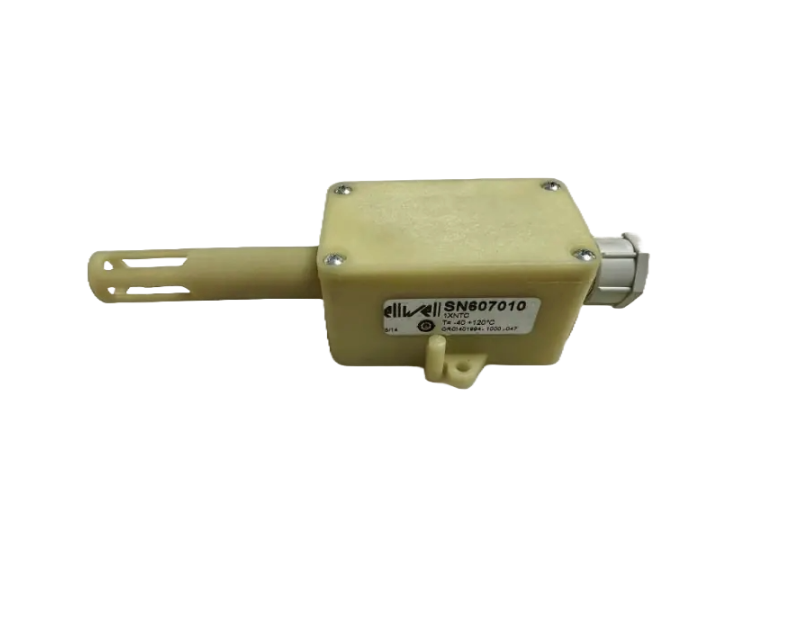 A beige Eliwell SN607010 NTC probe with a rectangular body and a cylindrical sensor tip, featuring ventilation slots. The label on the body reads "Eliwell SN607010" with specifications: "NTC 10Kohm 25°C, T -40/+120°C, 1000-067." The probe has a cable glan A beige Eliwell SN607010 NTC probe with a rectangular body and a cylindrical sensor tip, featuring ventilation slots. The label on the body reads "Eliwell SN607010" with specifications: "NTC 10Kohm 25°C, T -40/+120°C, 1000-067." The probe has a cable glan