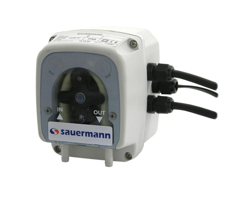 This is a white Sauermann PE-5100 peristaltic condensate pump with a transparent front panel that displays the internal roller mechanism. The pump features two black cables on the right side, labelled "IN" and "OUT" ports for suction and discharge, and th This is a white Sauermann PE-5100 peristaltic condensate pump with a transparent front panel that displays the internal roller mechanism. The pump features two black cables on the right side, labelled "IN" and "OUT" ports for suction and discharge, and th