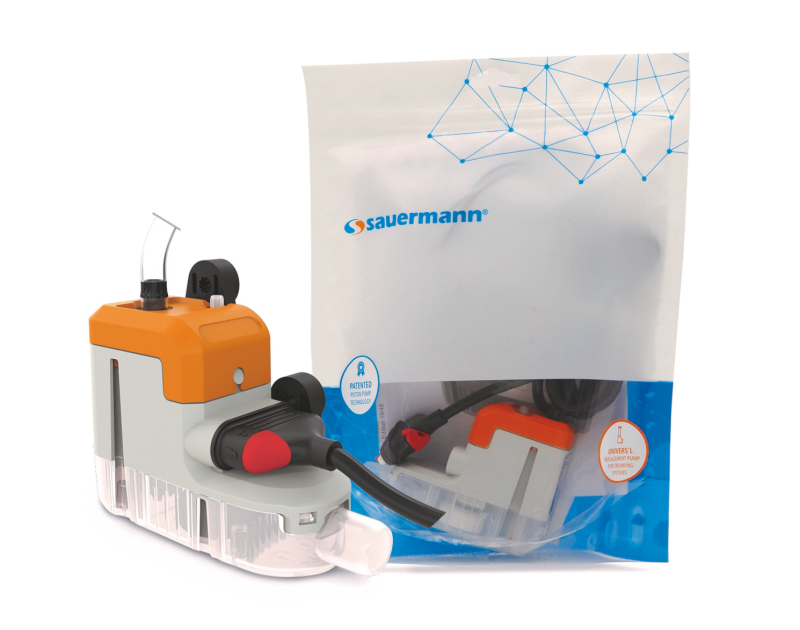 Sauermann Si-10 UNIVERS'L Piston Condensate Pump in packaging, showcasing the pump unit, transparent reservoir, and accessories for air conditioning units.